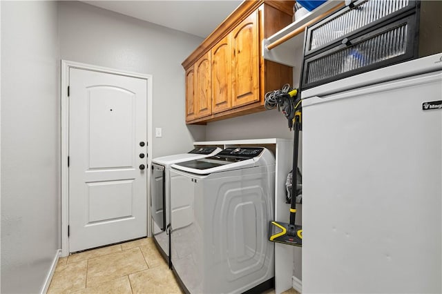 3902 Elvis Dr, Corpus Christi, TX 78414 - clothes washing area featuring separate washer and dryer, baseboards, and cabinet space