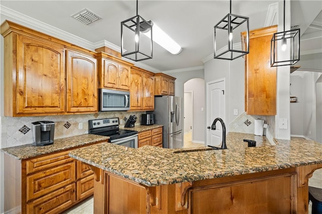 3902 Elvis Dr, Corpus Christi, TX 78414 - kitchen featuring stainless steel appliances, arched walkways, a sink, crown molding, and light stone countertops