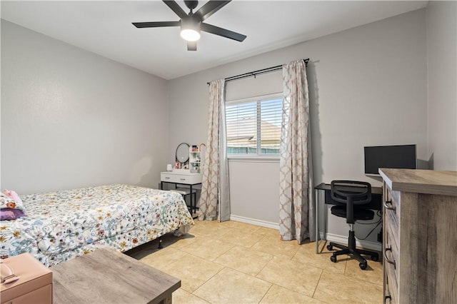 3902 Elvis Dr, Corpus Christi, TX 78414 - bedroom with a desk, baseboards, light tile patterned floors, and a ceiling fan