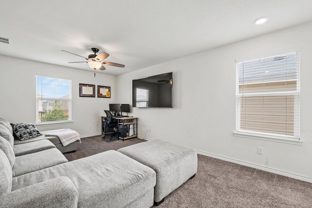 1947 Brandywine Dr, New Braunfels, TX 78132 - living room featuring carpet floors, a ceiling fan, and baseboards