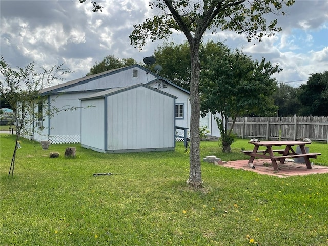 exterior space featuring a shed and a patio