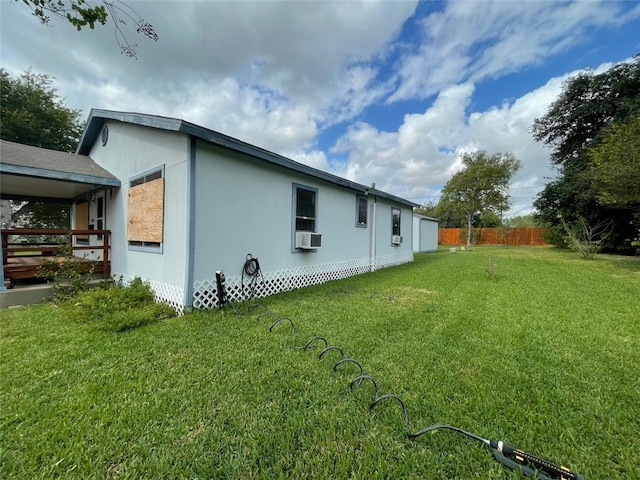 view of property exterior featuring cooling unit and a lawn