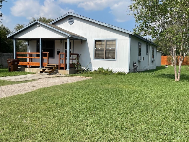 view of front of property with covered porch and a front lawn