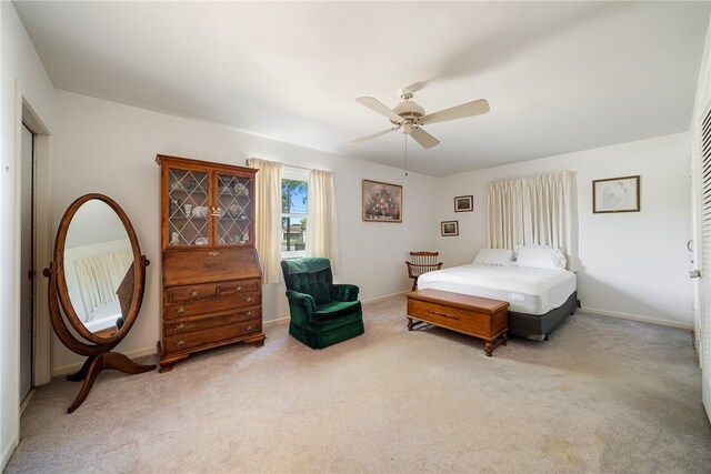 carpeted bedroom featuring ceiling fan