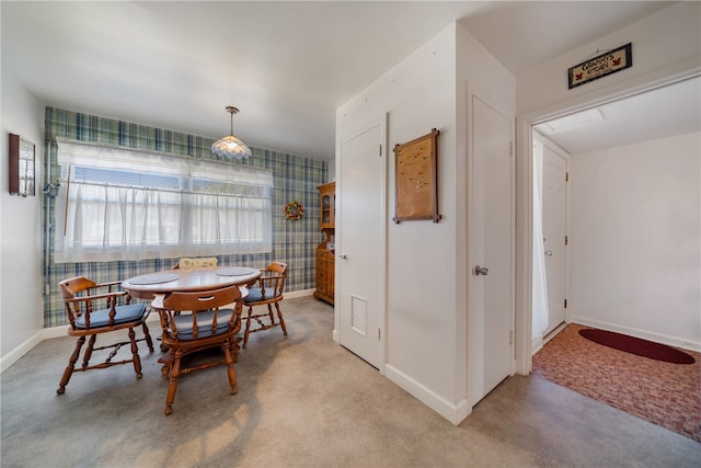 view of carpeted dining area