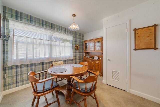 view of carpeted dining area