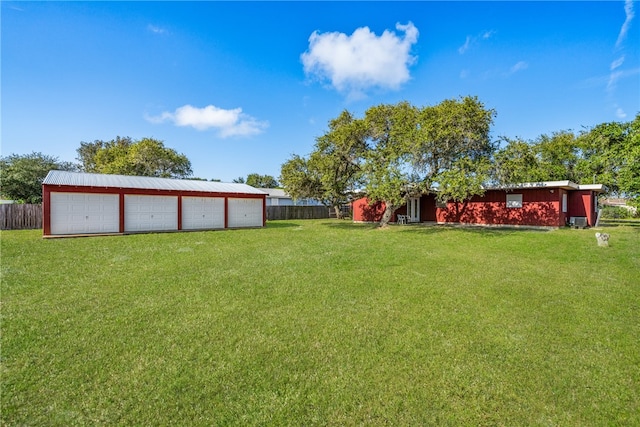 view of yard featuring an outbuilding and a garage