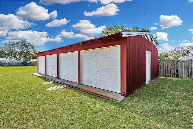 garage with a lawn