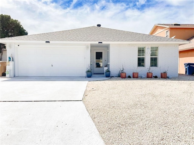 15321 Beaufort Ct, Corpus Christi, TX 78418 - ranch-style home featuring concrete driveway, a garage, brick siding, and a shingled roof