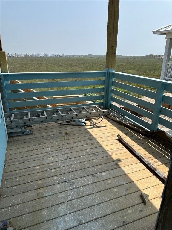 wooden terrace with a rural view