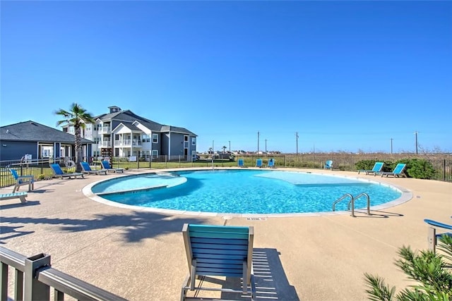 view of swimming pool with a patio area