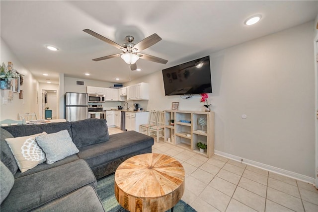 living room with recessed lighting, light tile patterned floors, baseboards, visible vents, and ceiling fan