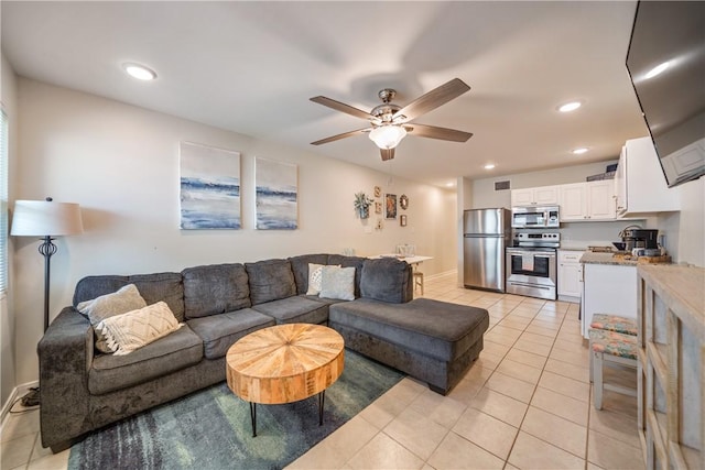 living room with baseboards, ceiling fan, recessed lighting, and light tile patterned flooring