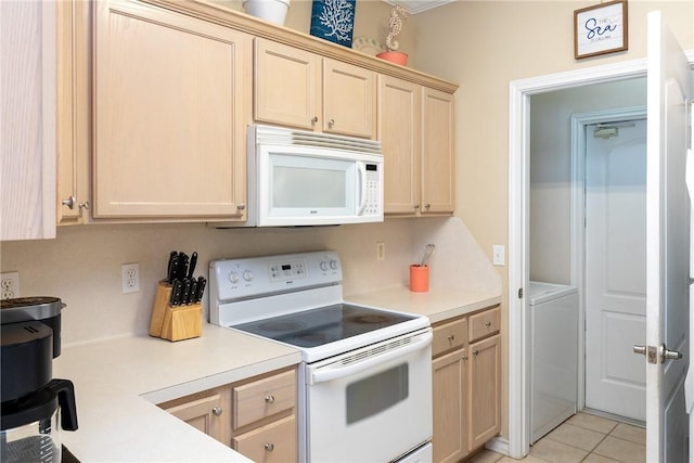 15102 Leeward Dr Unit 702, Corpus Christi, TX 78418 - kitchen with white appliances, washer / dryer, light countertops, and light brown cabinets