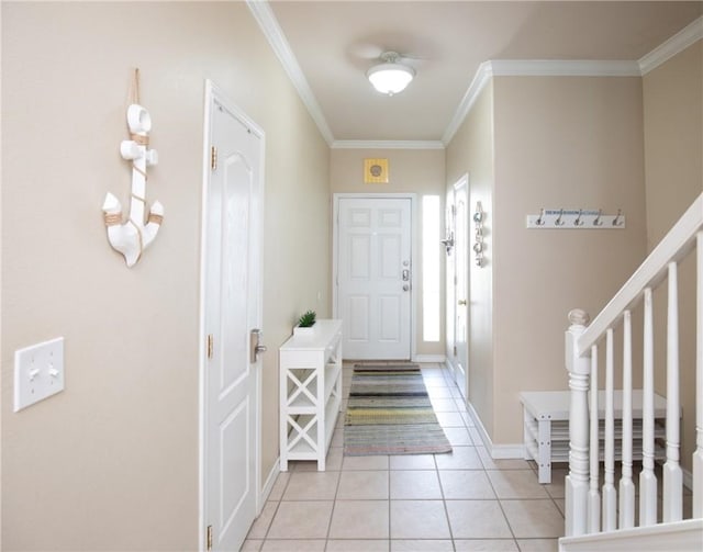 15102 Leeward Dr Unit 702, Corpus Christi, TX 78418 - entryway with crown molding, light tile patterned floors, stairway, and baseboards
