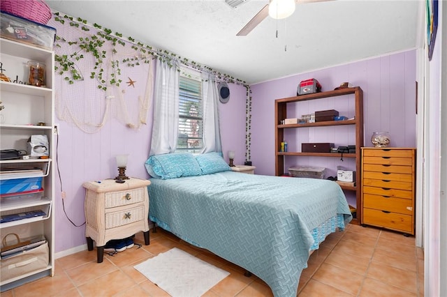 627 S Fuqua St, Rockport, TX 78382 - bedroom with light tile patterned floors and ceiling fan