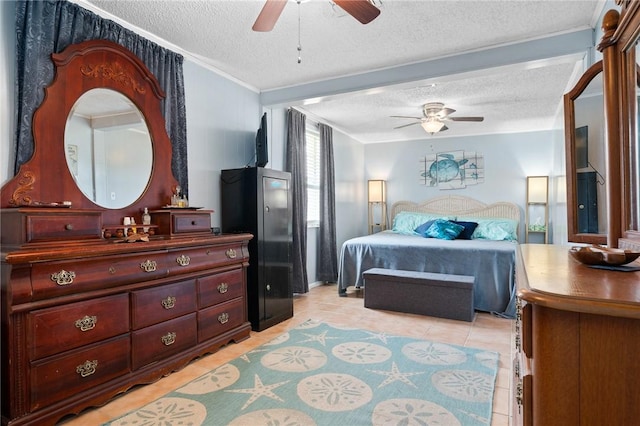 627 S Fuqua St, Rockport, TX 78382 - bedroom with a textured ceiling, crown molding, light tile patterned floors, and a ceiling fan
