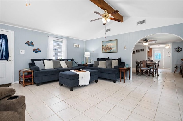 627 S Fuqua St, Rockport, TX 78382 - living area with ceiling fan, arched walkways, light tile patterned flooring, and healthy amount of natural light