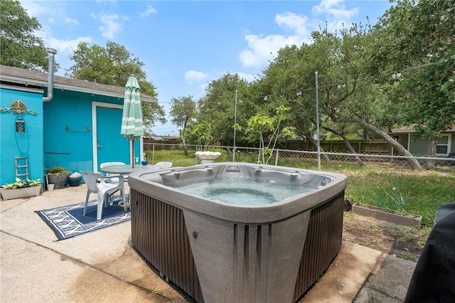 627 S Fuqua St, Rockport, TX 78382 - fenced backyard with a hot tub and a patio