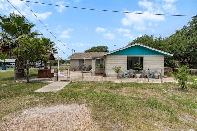 627 S Fuqua St, Rockport, TX 78382 - back of house with a gate and brick siding