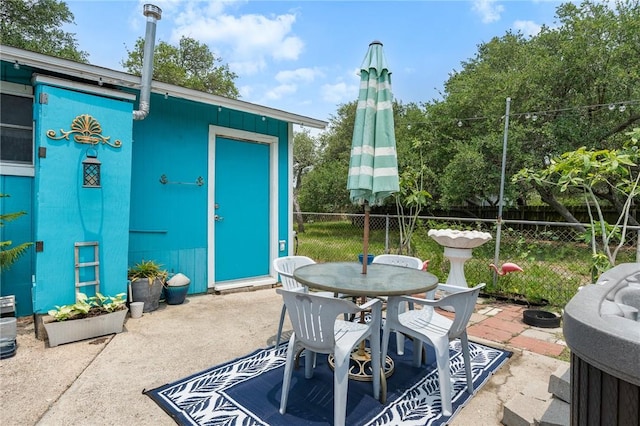 627 S Fuqua St, Rockport, TX 78382 - view of patio featuring outdoor dining area and an outdoor structure