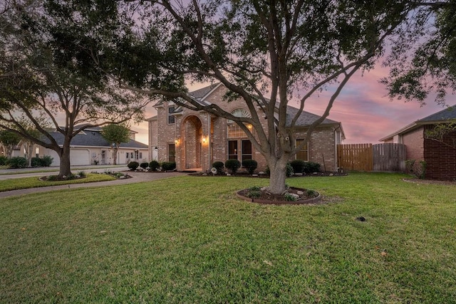 view of front of home with a lawn