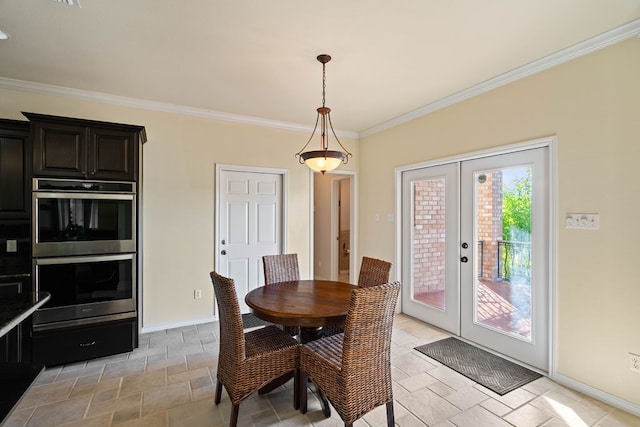 dining area featuring french doors and crown molding