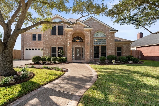 front of property with a garage and a front yard