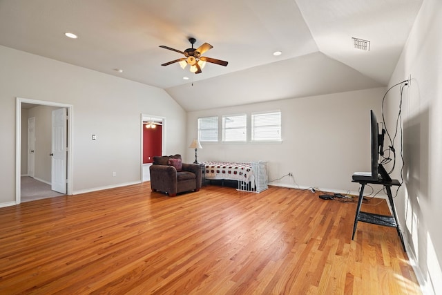 bedroom featuring lofted ceiling, light hardwood / wood-style floors, and ceiling fan