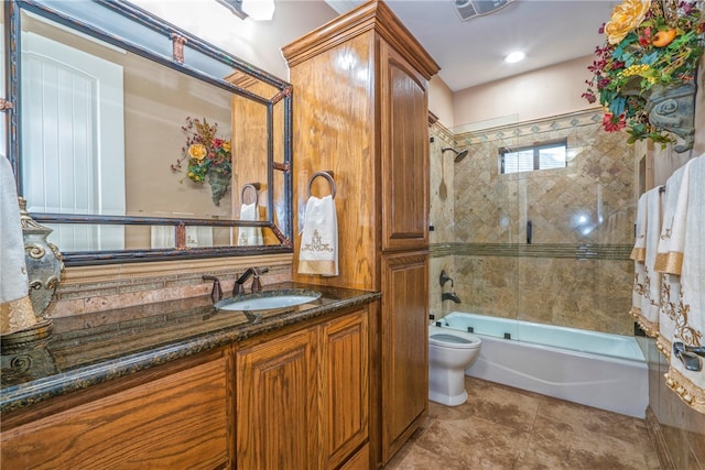 full bathroom featuring toilet, tile patterned floors, vanity, and shower / bath combination with glass door