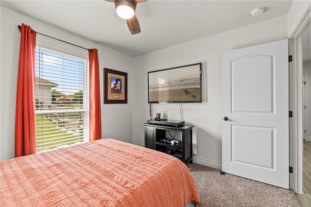 177 Glenvalley Cir, Bandera, TX 78003 - bedroom with ceiling fan, multiple windows, baseboards, and carpet