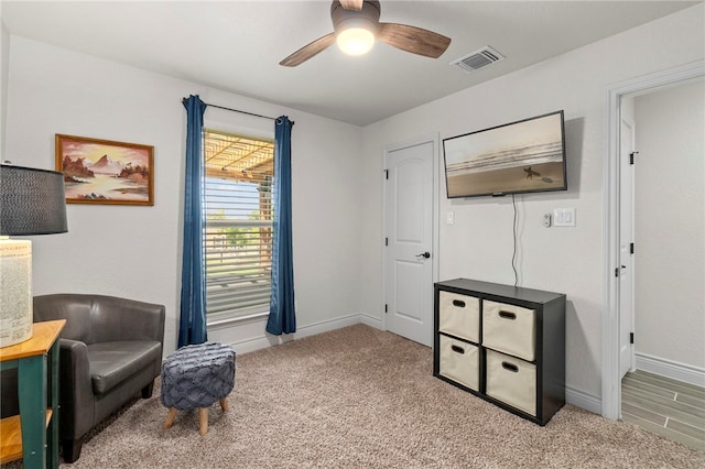 177 Glenvalley Cir, Bandera, TX 78003 - living area featuring carpet, baseboards, a ceiling fan, and visible vents
