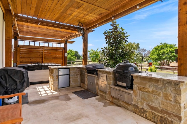 177 Glenvalley Cir, Bandera, TX 78003 - view of patio featuring a grill and an outdoor kitchen
