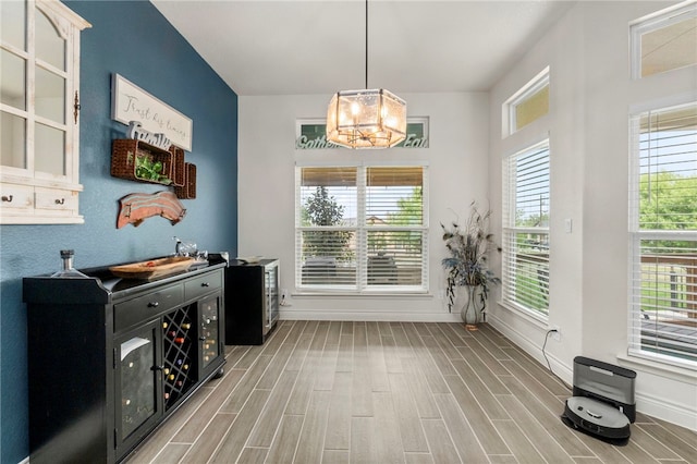 177 Glenvalley Cir, Bandera, TX 78003 - dining space with a chandelier, a wealth of natural light, and wood finished floors