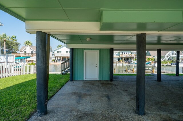 exterior space with a lawn and a water view