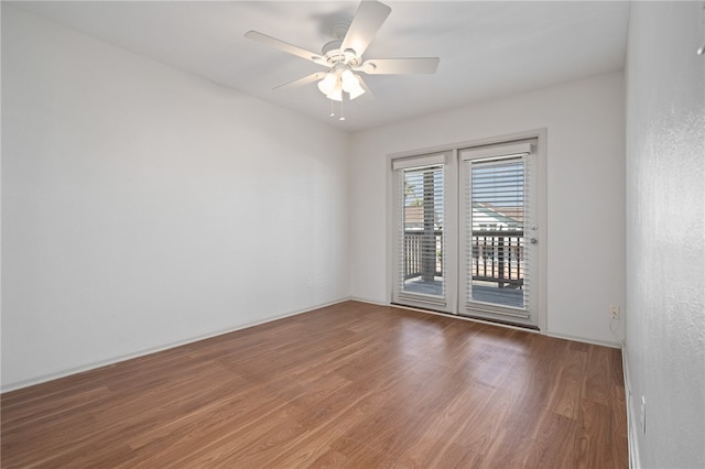 spare room featuring hardwood / wood-style flooring and ceiling fan