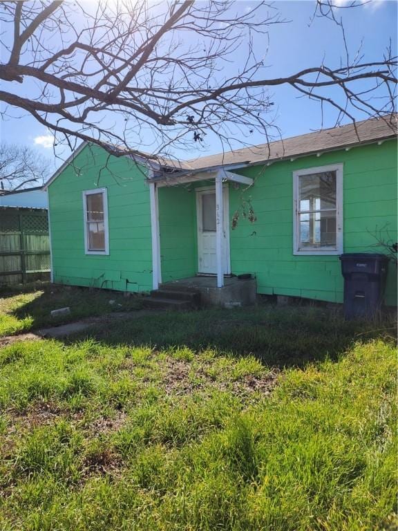 view of front of home with fence