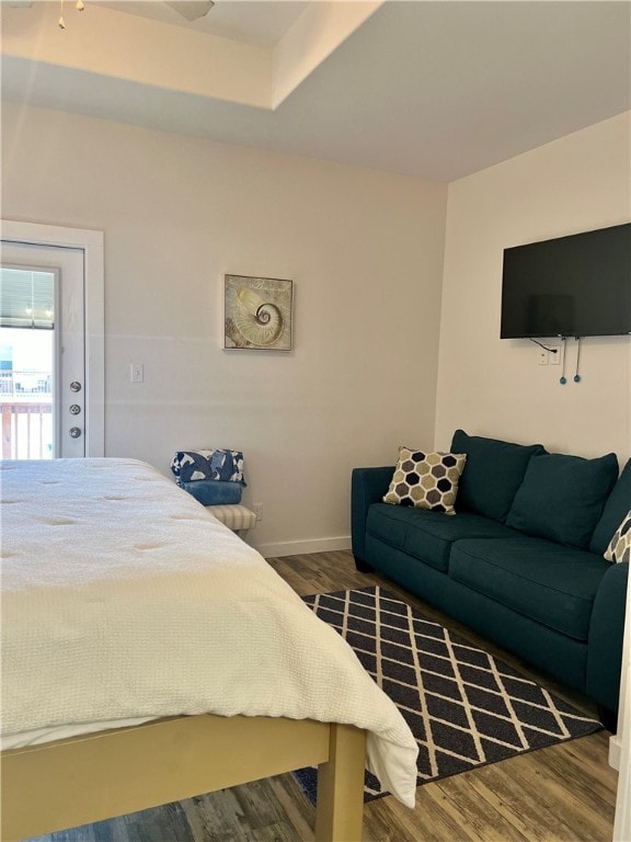 bedroom with dark wood-type flooring