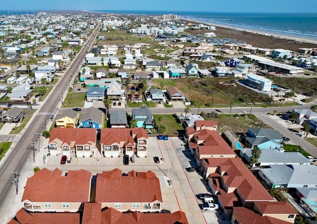 drone / aerial view with a beach view and a water view