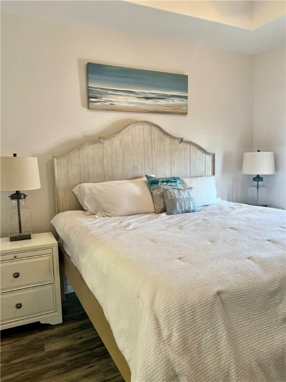 bedroom featuring dark hardwood / wood-style flooring