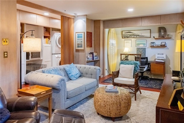 living room featuring stacked washer and clothes dryer