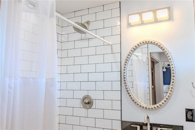 bathroom with sink and curtained shower