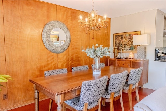 dining space with an inviting chandelier