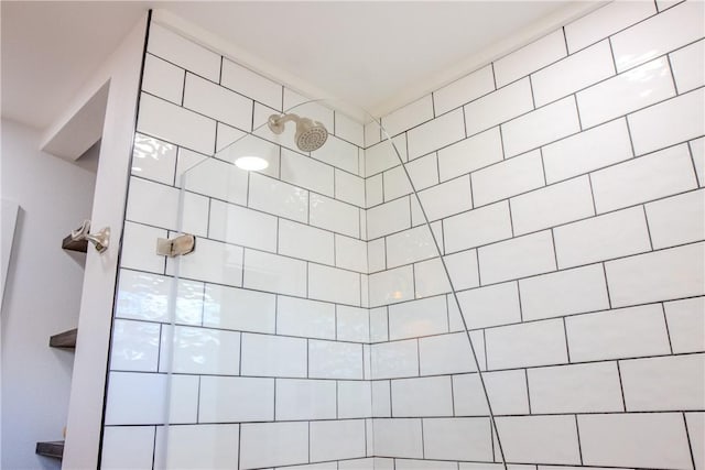 bathroom with tiled shower