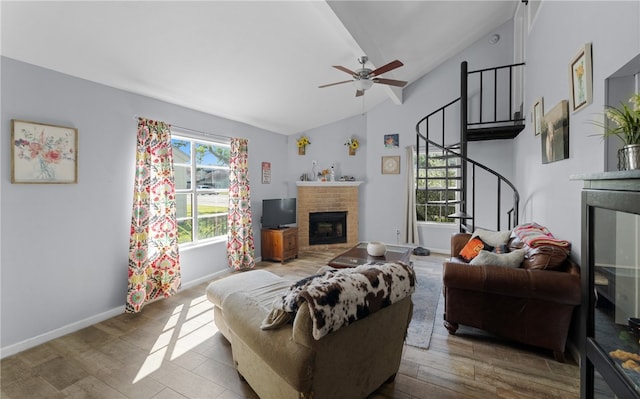 7202 Mansions Dr Unit H3, Corpus Christi, TX 78414 - living area featuring a brick fireplace, vaulted ceiling, stairway, wood finished floors, and ceiling fan