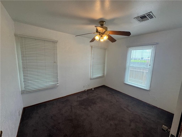 1222 Nancy St, Corpus Christi, TX 78412 - empty room featuring dark colored carpet and ceiling fan