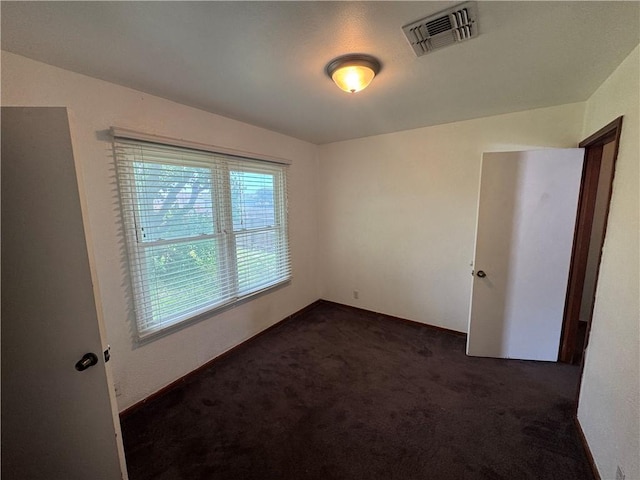 1222 Nancy St, Corpus Christi, TX 78412 - unfurnished room featuring dark colored carpet and baseboards