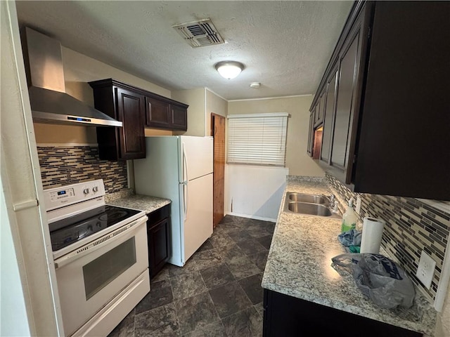 1222 Nancy St, Corpus Christi, TX 78412 - kitchen featuring white appliances, wall chimney exhaust hood, backsplash, light countertops, and a textured ceiling