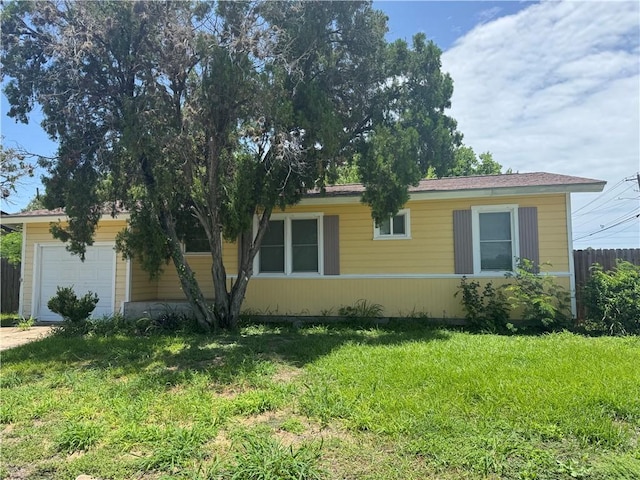 1222 Nancy St, Corpus Christi, TX 78412 - view of side of home with an attached garage and driveway