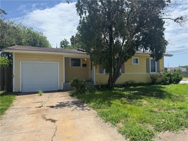 1222 Nancy St, Corpus Christi, TX 78412 - ranch-style house with driveway and an attached garage